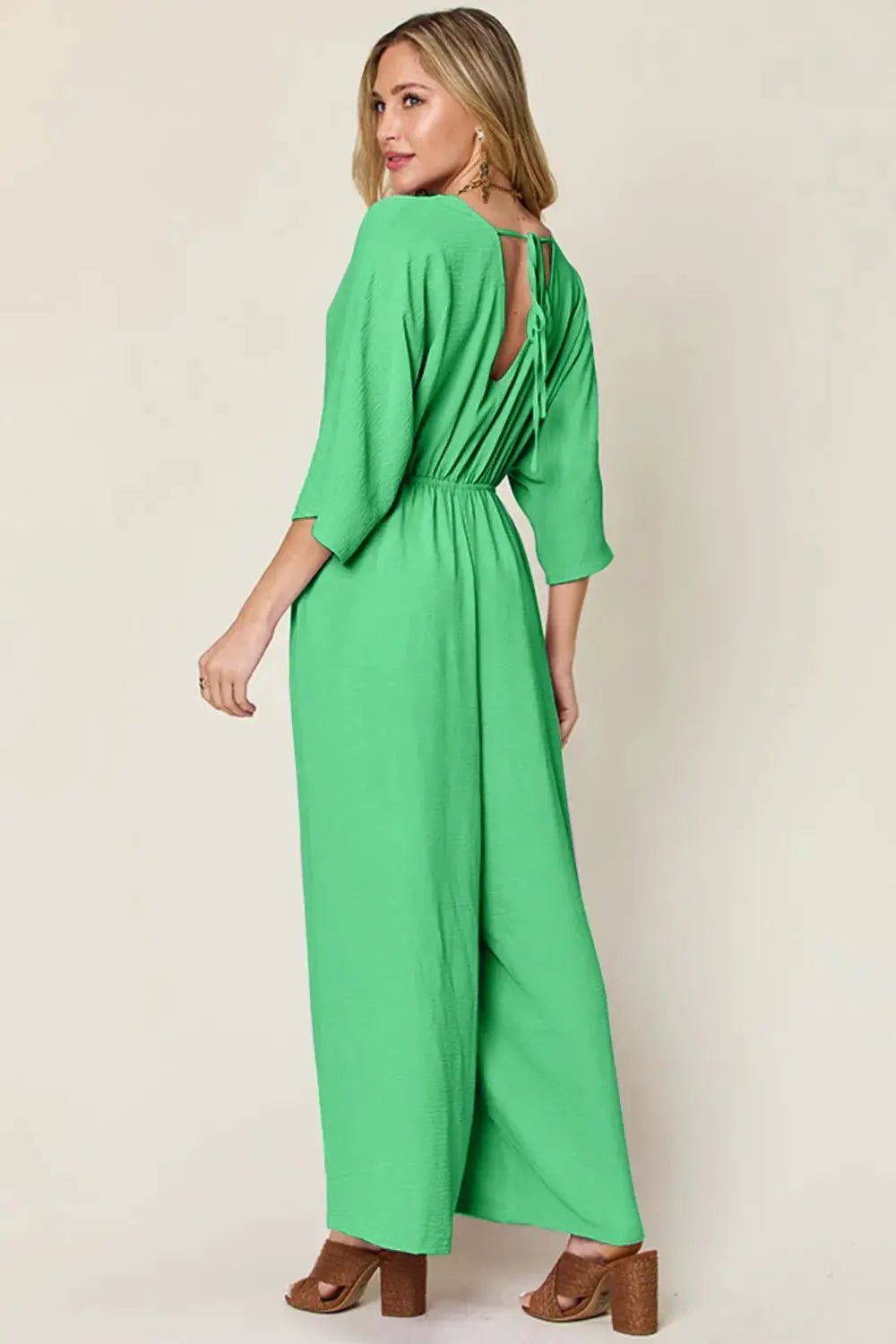 Double Take Surplice Wide Leg Jumpsuit With Pockets Full Size - Fritsch & Co.