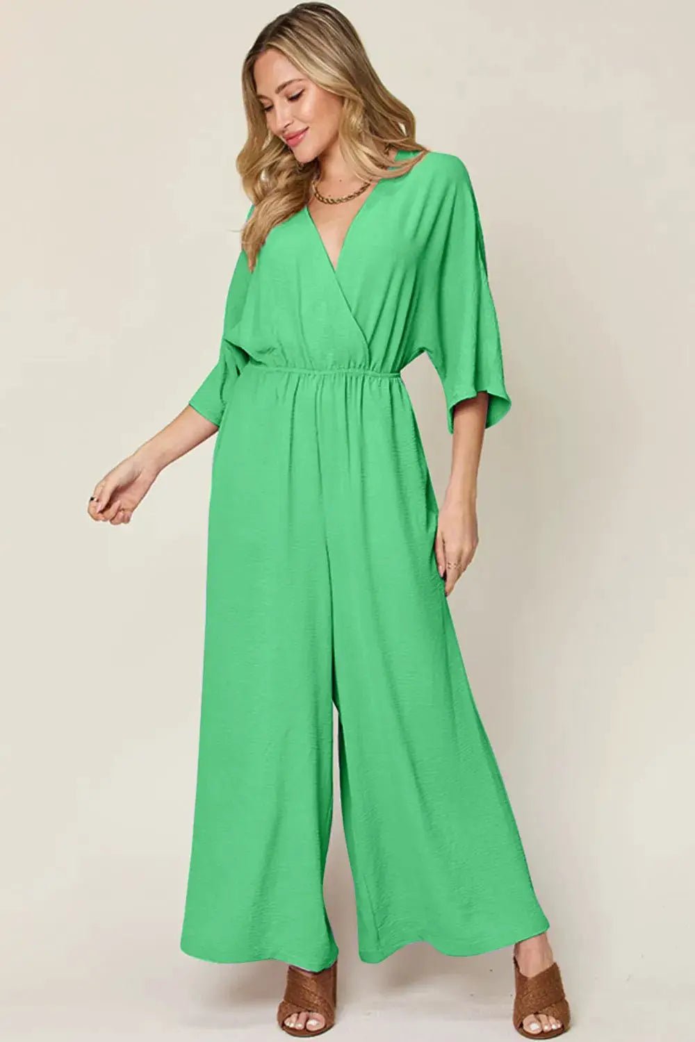 Double Take Surplice Wide Leg Jumpsuit With Pockets Full Size - Fritsch & Co.