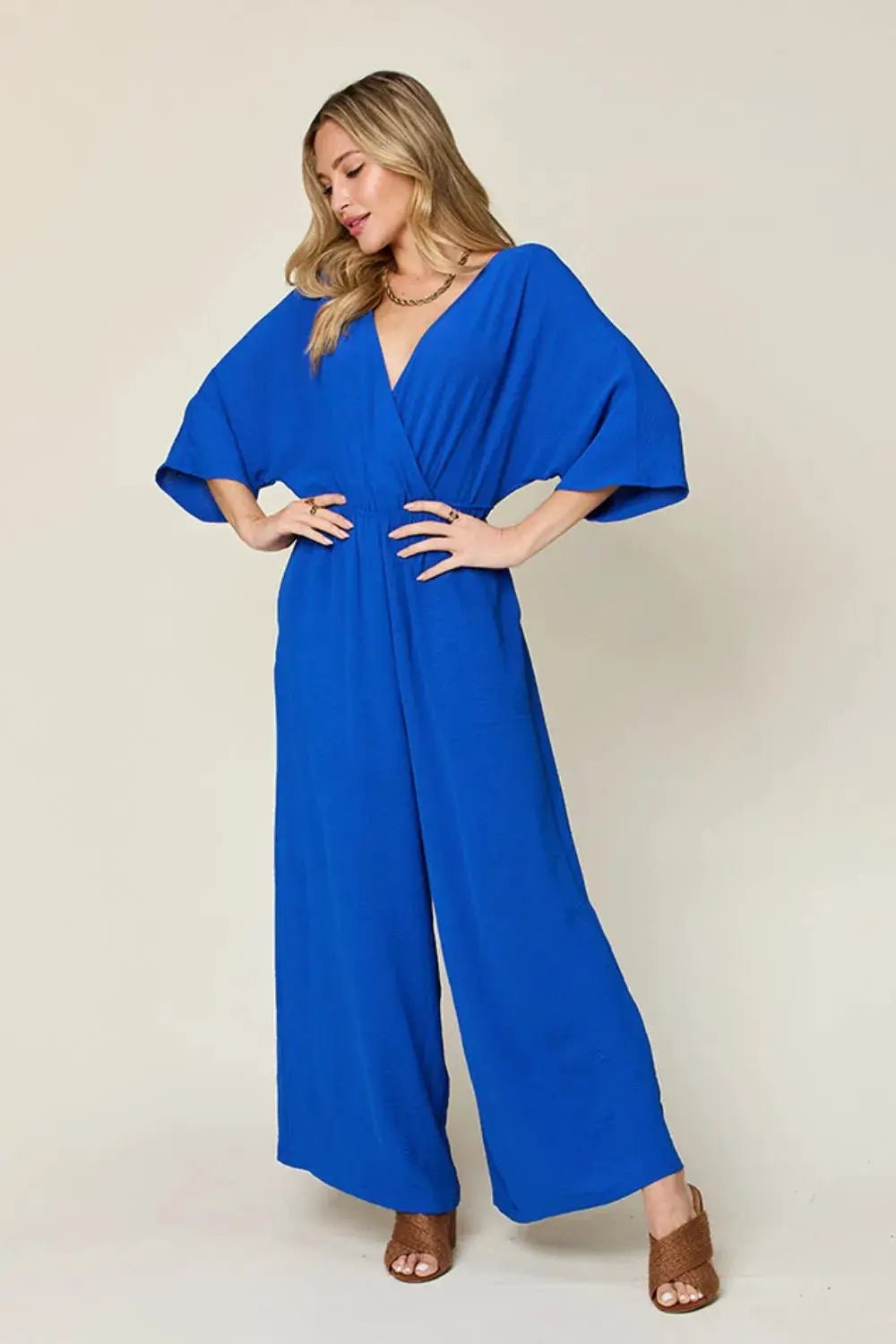 Double Take Surplice Wide Leg Jumpsuit With Pockets Full Size - Fritsch & Co.