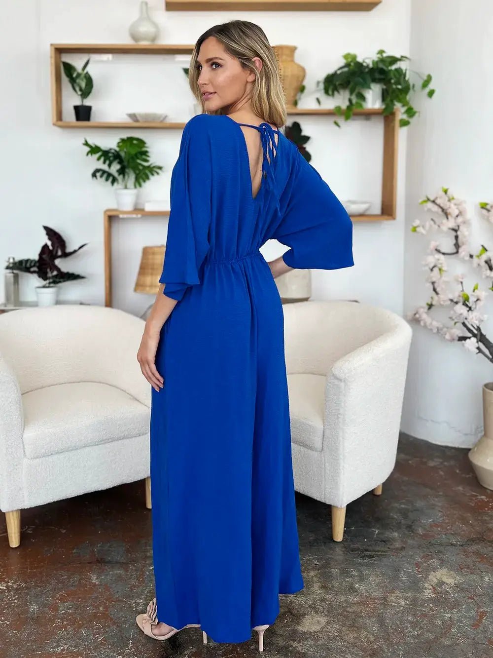 Double Take Surplice Wide Leg Jumpsuit With Pockets Full Size - Fritsch & Co.
