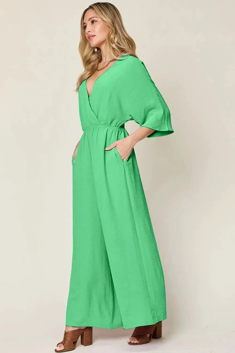 Double Take Surplice Wide Leg Jumpsuit With Pockets Full Size - Fritsch & Co.