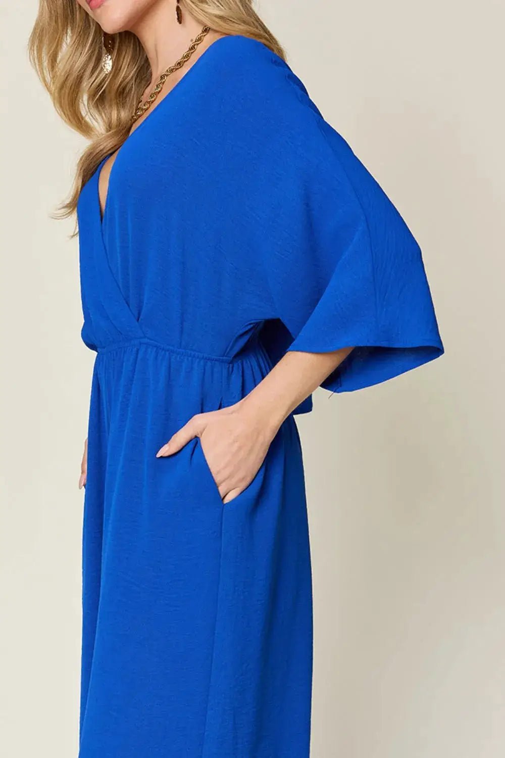 Double Take Surplice Wide Leg Jumpsuit With Pockets Full Size - Fritsch & Co.