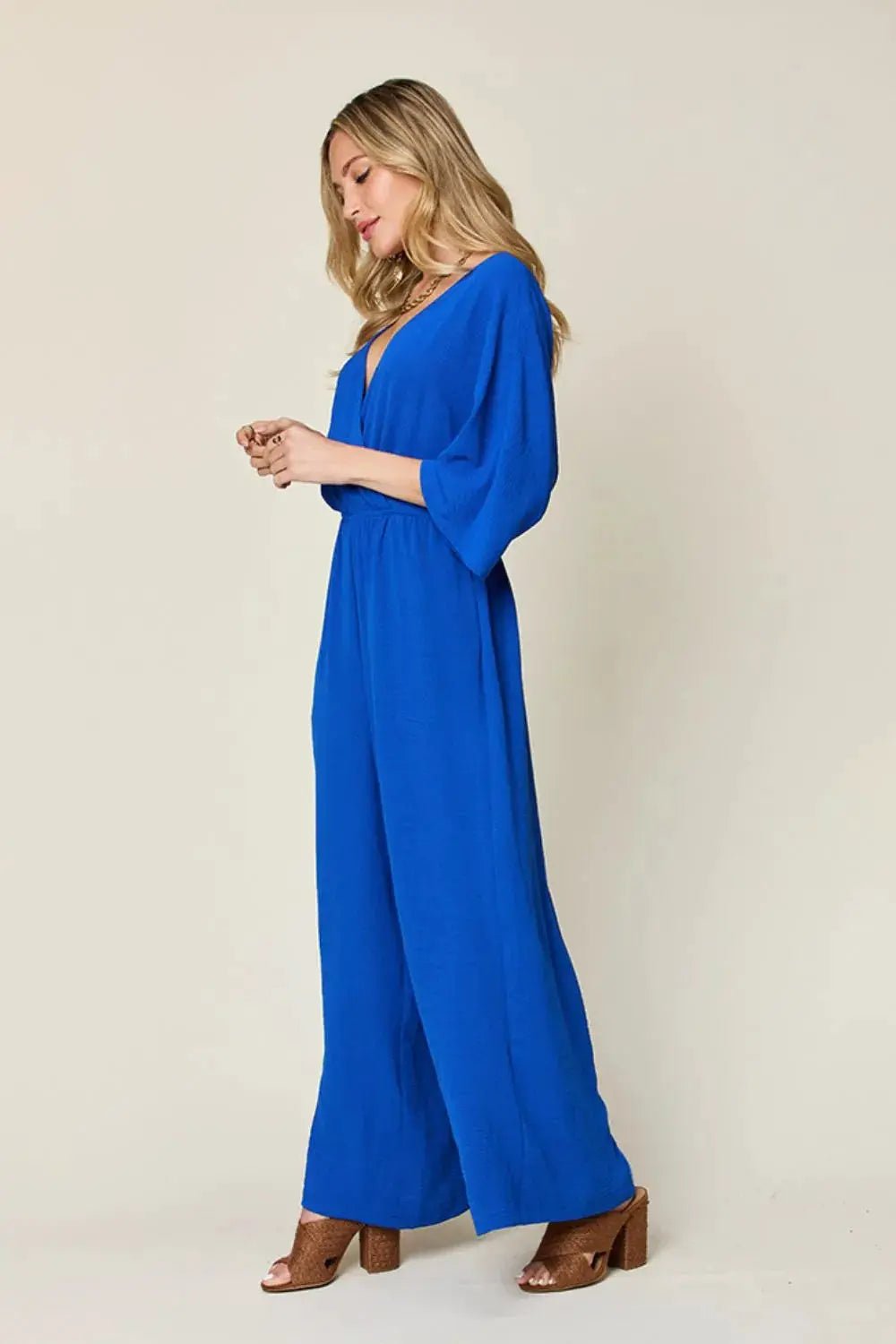 Double Take Surplice Wide Leg Jumpsuit With Pockets Full Size - Fritsch & Co.