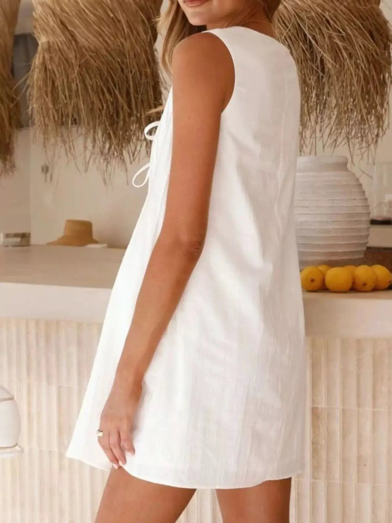 Sleeveless Tie Front Mini Dress With Ruched Detailing - Fritsch & Co.