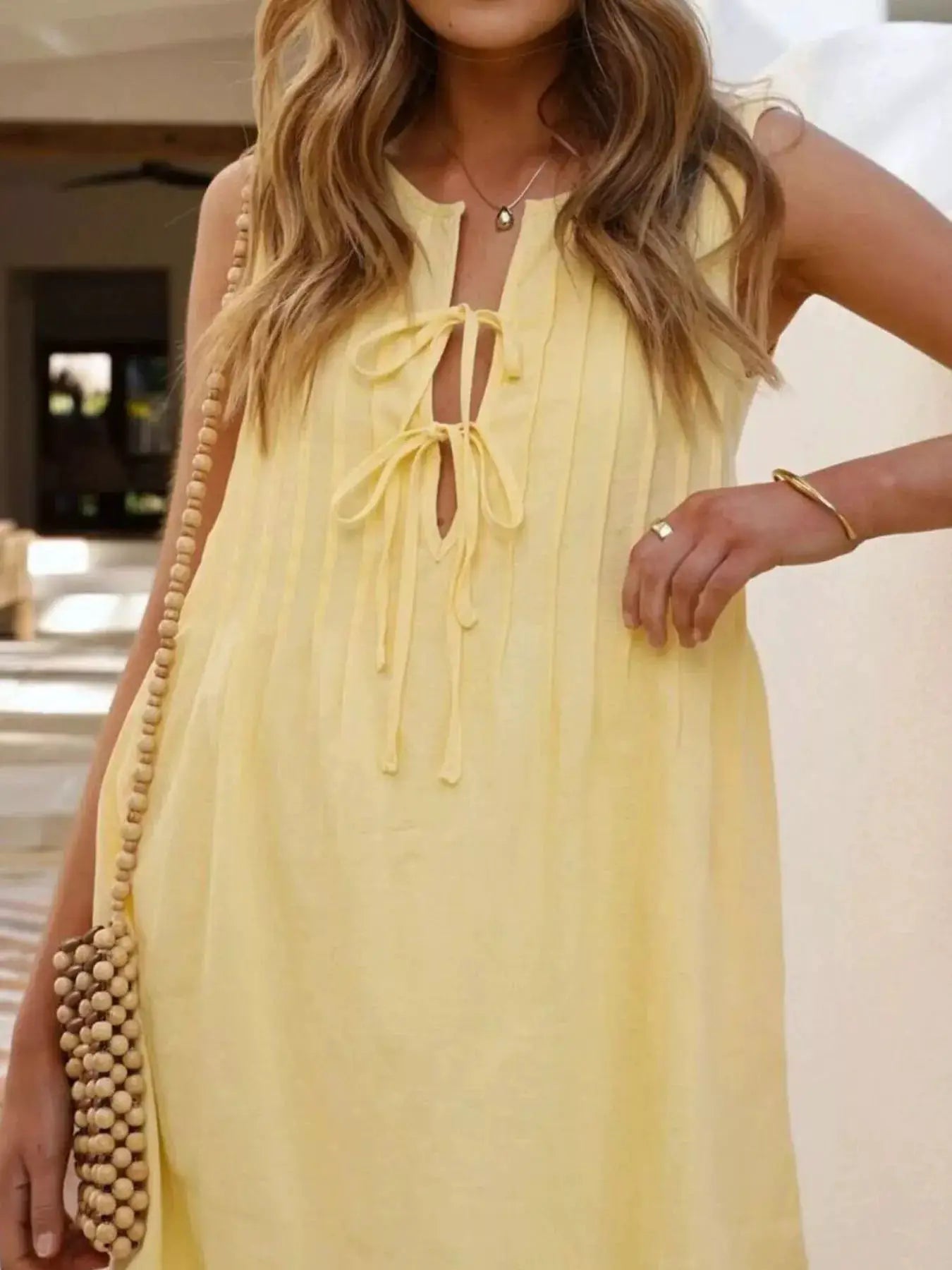 Sleeveless Tie Front Mini Dress With Ruched Detailing - Fritsch & Co.
